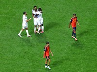 Soccer Football - FIFA World Cup 2026 - Group H - Spain v Cape Verde - Atlanta Stadium, Atlanta, Georgia, U.S. - June 15, 2026 Cape Verde players celebrate as Spain's Pau Cubarsi and Martin Zubimendi look dejected after the match REUTERS/Bernadett Sz