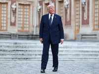 U.S. President Donald Trump is welcomed by French President Emmanuel Macron and his wife Brigitte Macron ahead of a dinner commemorating the 250th anniversary of the United States' independence, at the Palace of Versailles, near Paris, France, June 1