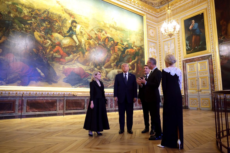 U.S. President Donald Trump receives a tour of Chateau de Versailles from President of France Emmanuel Macron and his wife Brigitte Macron ahead of a dinner, France, June 17, 2026. Anna Moneymaker/Pool via REUTERS