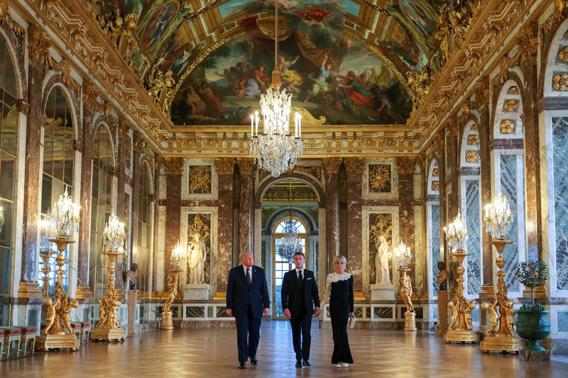 U.S. President Donald Trump receives a tour of Chateau de Versailles from President of France Emmanuel Macron and his wife Brigitte Macron ahead of a dinner, France, June 17, 2026. Anna Moneymaker/Pool via REUTERS