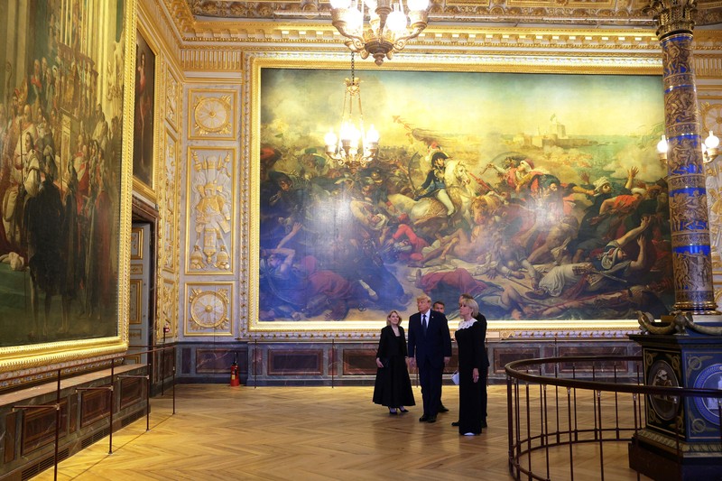 U.S. President Donald Trump receives a tour of Chateau de Versailles from President of France Emmanuel Macron and his wife Brigitte Macron ahead of a dinner, France, June 17, 2026. Anna Moneymaker/Pool via REUTERS