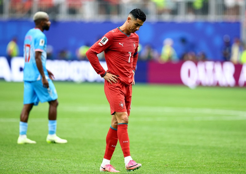 Soccer Football - FIFA World Cup 2026 - Group K - Portugal v DR Congo - Houston Stadium, Houston, Texas, U.S. - June 17, 2026 DR Congo's Edo Kayembe in action with Portugal's Nuno Mendes REUTERS/Pedro Nunes