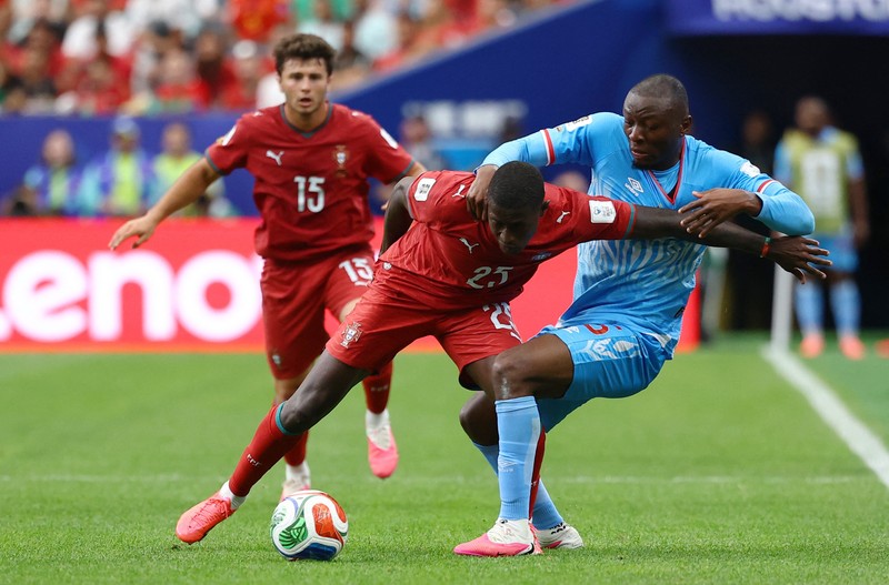 Soccer Football - FIFA World Cup 2026 - Group K - Portugal v DR Congo - Houston Stadium, Houston, Texas, U.S. - June 17, 2026 DR Congo's Edo Kayembe in action with Portugal's Nuno Mendes REUTERS/Pedro Nunes