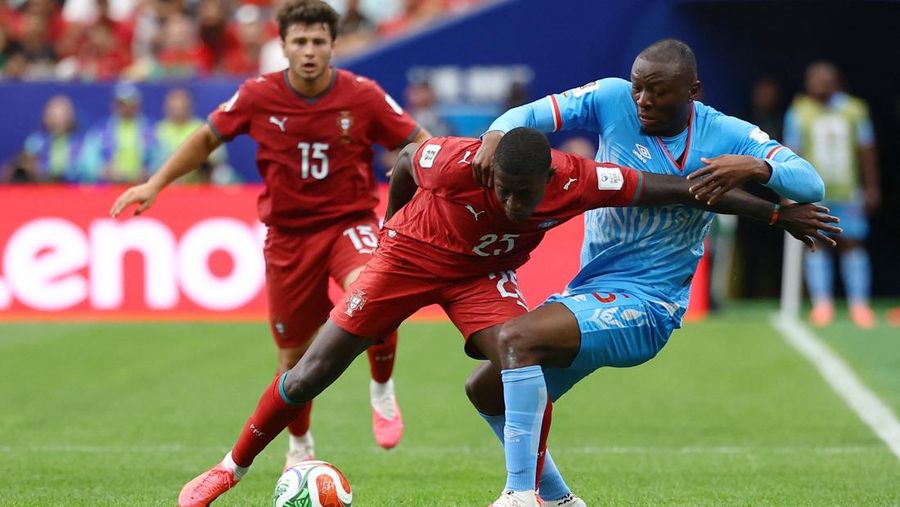 Soccer Football - FIFA World Cup 2026 - Group K - Portugal v DR Congo - Houston Stadium, Houston, Texas, U.S. - June 17, 2026 DR Congo's Edo Kayembe in action with Portugal's Nuno Mendes REUTERS/Pedro Nunes
