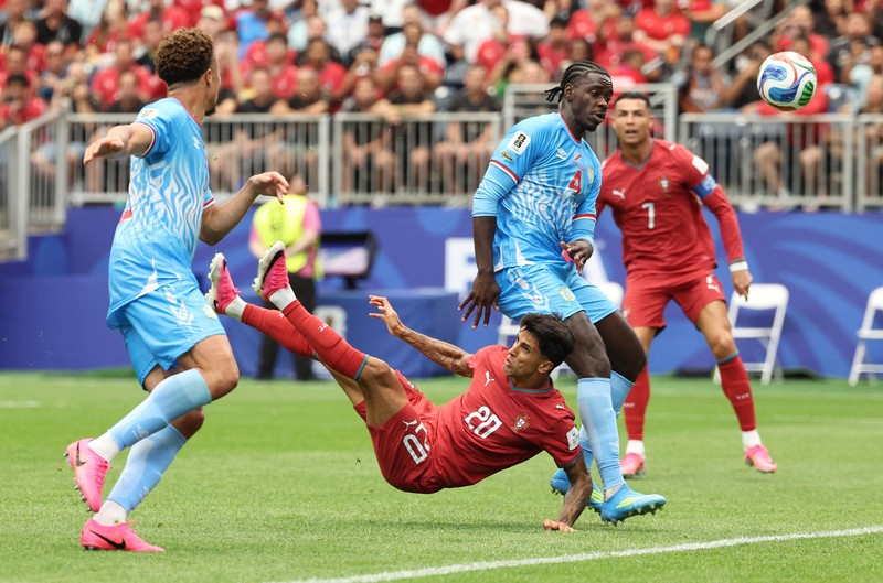 Soccer Football - FIFA World Cup 2026 - Group K - Portugal v DR Congo - Houston Stadium, Houston, Texas, U.S. - June 17, 2026 DR Congo's Edo Kayembe in action with Portugal's Nuno Mendes REUTERS/Pedro Nunes
