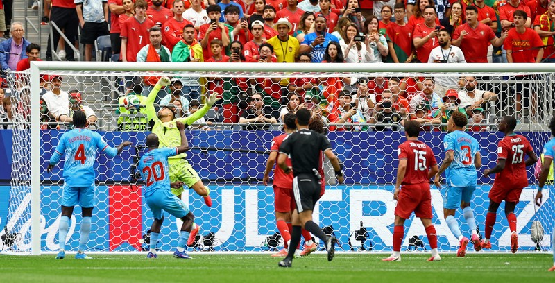 Soccer Football - FIFA World Cup 2026 - Group K - Portugal v DR Congo - Houston Stadium, Houston, Texas, U.S. - June 17, 2026 DR Congo's Edo Kayembe in action with Portugal's Nuno Mendes REUTERS/Pedro Nunes