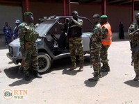 Security personnel stand guard, following an attack on Thursday at the airport and military airbase in Niger's capital, for which the West Africa's al Qaeda affiliate, Jama'at Nusrat al-Islam wal Muslimin (JNIM), claims responsibility, in Niamey, Nig