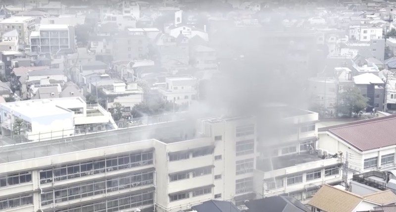 Smoke rises as students are evacuated from a primary school, after a fire broke out, in Kita city, Tokyo, Japan June 19, 2026, in this screengrab obtained from a social media video. @takanyo VIA X/via REUTERS  THIS IMAGE HAS BEEN SUPPLIED BY A THIRD PARTY. MANDATORY CREDIT. NO RESALES. NO ARCHIVES.     TPX IMAGES OF THE DAY        VERIFICATION: - Location confirmed from metadata, buildings, train track and signage that match archive and satellite imagery - Date confirmed by file data and local media report