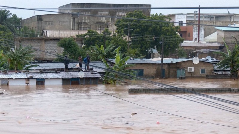 A person wades through floodwaters, in Accra, Ghana, in this still image taken from a video, June 29, 2026. Reuters TV via REUTERS