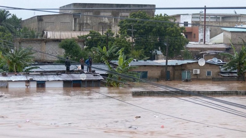 A person wades through floodwaters, in Accra, Ghana, in this still image taken from a video, June 29, 2026. Reuters TV via REUTERS
