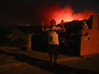 Residents await at a gas station amid wildfires, near Calonge, Spain, July 3, 2026. REUTERS/Bruna Casas