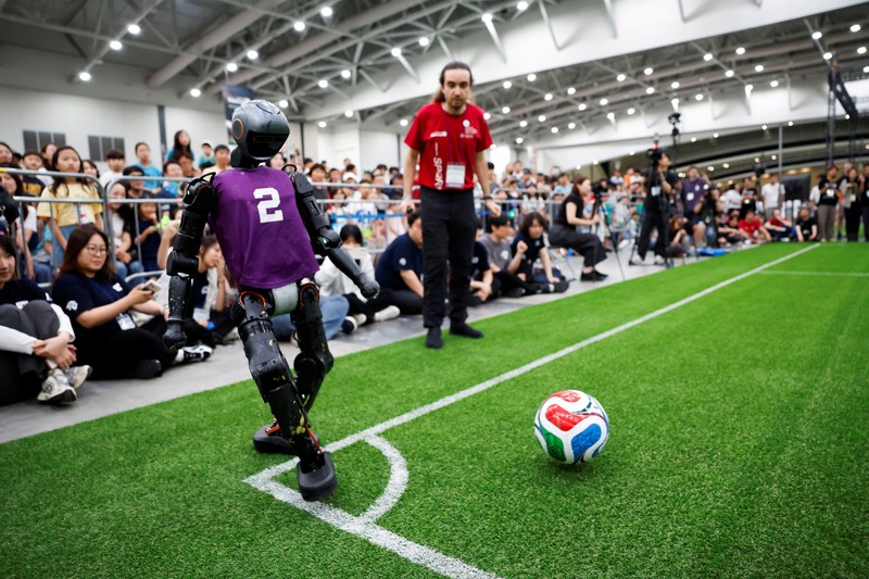 Humanoid robots compete during the Large Division final match between Team Hephaestus of Tsinghua University and Team Mountain and Sea of China Agricultural University at the RoboCup 2026 international robot competition in Incheon, South Korea, July 5, 2026. REUTERS/Kim Soo-hyeon