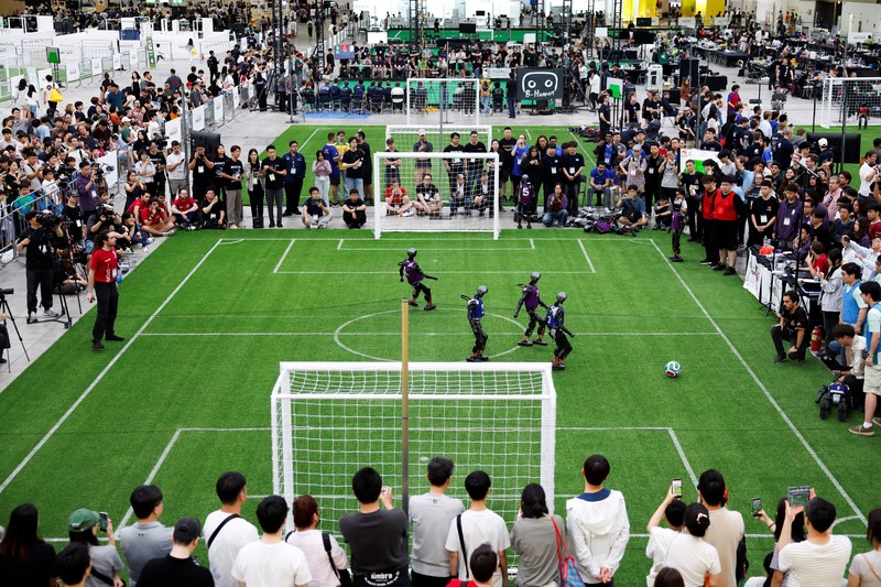 Humanoid robots compete during the Large Division final match between Team Hephaestus of Tsinghua University and Team Mountain and Sea of China Agricultural University at the RoboCup 2026 international robot competition in Incheon, South Korea, July 5, 2026. REUTERS/Kim Soo-hyeon