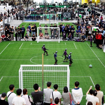 Humanoid robots compete during the Large Division final match between Team Hephaestus of Tsinghua University and Team Mountain and Sea of China Agricultural University at the RoboCup 2026 international robot competition in Incheon, South Korea, July