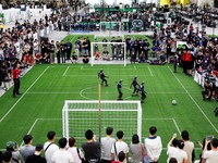 Humanoid robots compete during the Large Division final match between Team Hephaestus of Tsinghua University and Team Mountain and Sea of China Agricultural University at the RoboCup 2026 international robot competition in Incheon, South Korea, July