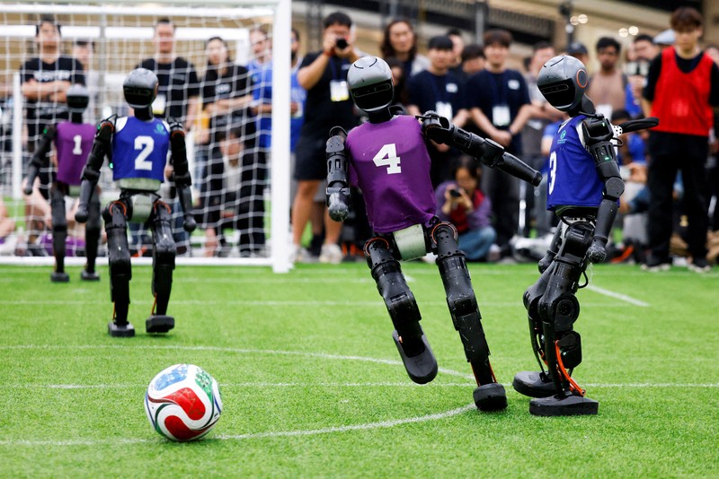 Humanoid robots compete during the Large Division final match between Team Hephaestus of Tsinghua University and Team Mountain and Sea of China Agricultural University at the RoboCup 2026 international robot competition in Incheon, South Korea, July 5, 2026. REUTERS/Kim Soo-hyeon