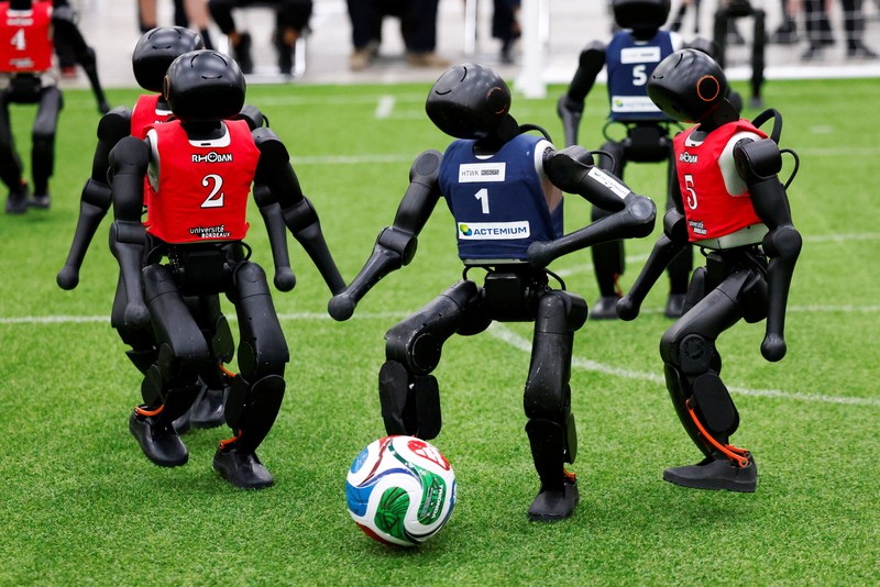Humanoid robots compete during the Large Division final match between Team Hephaestus of Tsinghua University and Team Mountain and Sea of China Agricultural University at the RoboCup 2026 international robot competition in Incheon, South Korea, July 5, 2026. REUTERS/Kim Soo-hyeon