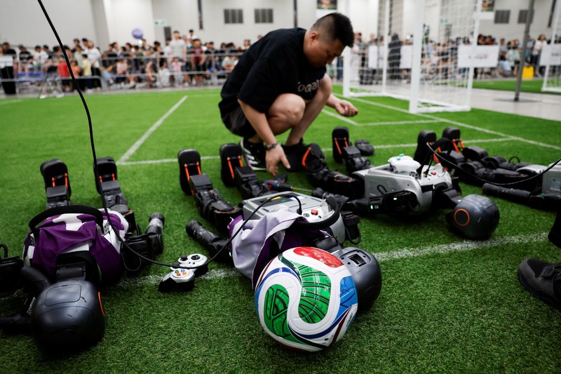 Humanoid robots compete during the Large Division final match between Team Hephaestus of Tsinghua University and Team Mountain and Sea of China Agricultural University at the RoboCup 2026 international robot competition in Incheon, South Korea, July 5, 2026. REUTERS/Kim Soo-hyeon