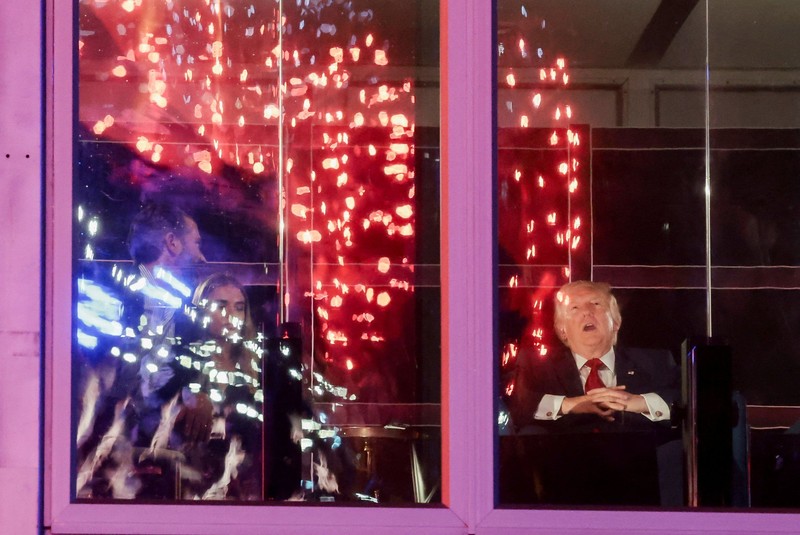 U.S. President Donald Trump watches fireworks explode during the Freedom 250's Salute to America as the United States celebrates its 250th anniversary on Independence Day, attempting the largest firework display in history with 850,000 fireworks in Washington, D.C., U.S., July 5, 2026. REUTERS/Jonathan Ernst
