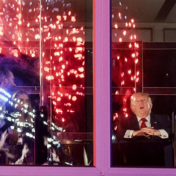 U.S. President Donald Trump watches fireworks explode during the Freedom 250's Salute to America as the United States celebrates its 250th anniversary on Independence Day, attempting the largest firework display in history with 850,000 fireworks in W