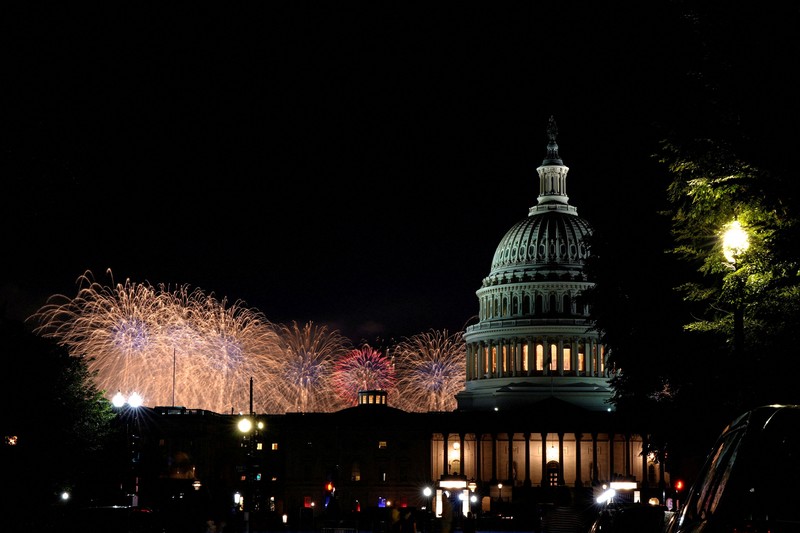 U.S. President Donald Trump watches fireworks explode during the Freedom 250's Salute to America as the United States celebrates its 250th anniversary on Independence Day, attempting the largest firework display in history with 850,000 fireworks in Washington, D.C., U.S., July 5, 2026. REUTERS/Jonathan Ernst