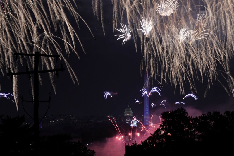 U.S. President Donald Trump watches fireworks explode during the Freedom 250's Salute to America as the United States celebrates its 250th anniversary on Independence Day, attempting the largest firework display in history with 850,000 fireworks in Washington, D.C., U.S., July 5, 2026. REUTERS/Jonathan Ernst