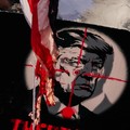 Bendera Amerika yang dibakar oleh para pelayat, berkobar di dekat papan bertuliskan Presiden AS Donald Trump, saat orang-orang berkumpul pada hari prosesi pemakaman mendiang Pemimpin Tertinggi Iran Ayatollah Ali Khamenei, yang tewas pada 28 Februari