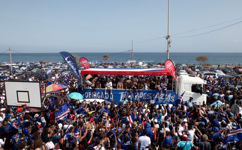 Soccer Football - FIFA World Cup 2026 - Cape Verde arrive home in Praia - Praia, Cape Verde - July 5, 2026 A drone view shows the Quebra Canela beach where Cape Verde fans gather with their national flags to welcome their players and celebrate their arrival from the United States REUTERS/Danilson Sequeira     TPX IMAGES OF THE DAY