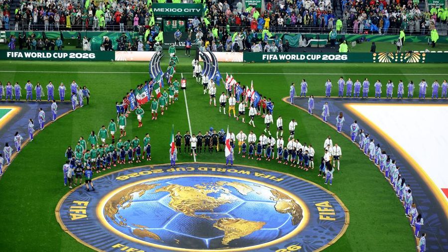 Soccer Football - FIFA World Cup 2026 - Round of 16 - Mexico v England - Estadio Azteca, Mexico City, Mexico - July 5, 2026 The teams walk out with young mascots during the national anthems before the match REUTERS/Henry Romero