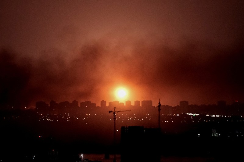 An explosion lights up the sky over the city during a Russian missile and drone strike, amid Russia's attack on Ukraine, in Kyiv, Ukraine July 6, 2026. REUTERS/Vladyslav Sodel
