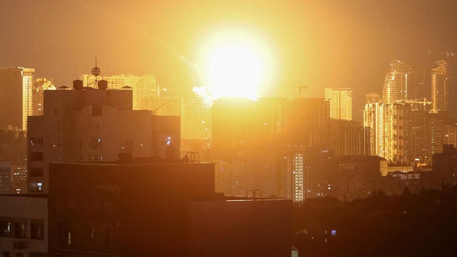 An explosion lights up the sky over the city during a Russian missile and drone strike, amid Russia's attack on Ukraine, in Kyiv, Ukraine July 6, 2026. REUTERS/Gleb Garanich     TPX IMAGES OF THE DAY