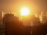 An explosion lights up the sky over the city during a Russian missile and drone strike, amid Russia's attack on Ukraine, in Kyiv, Ukraine July 6, 2026. REUTERS/Gleb Garanich     TPX IMAGES OF THE DAY