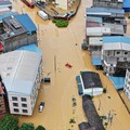Sebuah tayangan drone menunjukkan banjir di desa Pingshan setelah hujan lebat yang dibawa oleh Topan Maysak, di Hengzhou, Daerah Otonomi Guangxi Zhuang, Tiongkok, 6 Juli 2026. (cnsphoto via REUTERS)