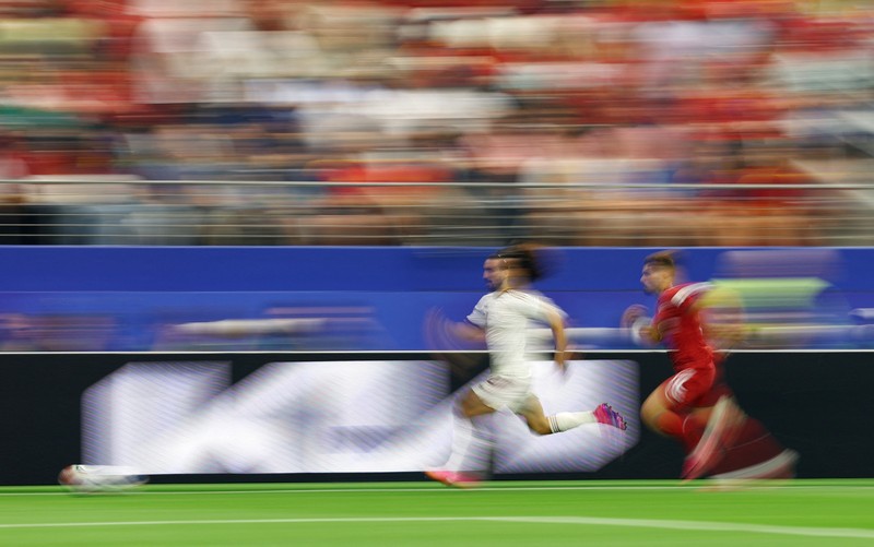Soccer Football - FIFA World Cup 2026 - Round of 16 - Portugal v Spain - Dallas Stadium, Arlington, Texas, U.S. - July 6, 2026 Spain players celebrate after the match as Portugal players look dejected following their elimination from the World Cup REUTERS/Issei Kato