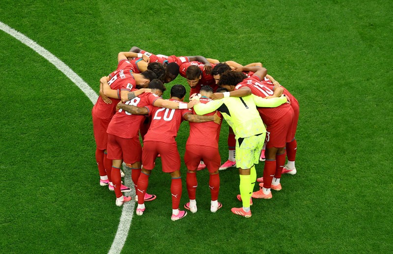 Soccer Football - FIFA World Cup 2026 - Round of 16 - Portugal v Spain - Dallas Stadium, Arlington, Texas, U.S. - July 6, 2026 Spain players celebrate after the match as Portugal players look dejected following their elimination from the World Cup REUTERS/Issei Kato
