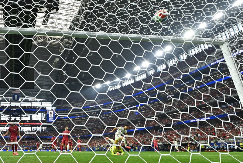 Soccer Football - FIFA World Cup 2026 - Round of 16 - Portugal v Spain - Dallas Stadium, Arlington, Texas, U.S. - July 6, 2026 Spain players celebrate after the match as Portugal players look dejected following their elimination from the World Cup REUTERS/Issei Kato