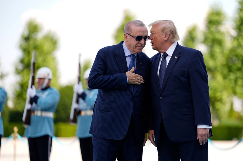 U.S. President Donald Trump shakes hands with Turkish President Recep Tayyip Erdogan during a formal arrival at the Bestepe Presidential Compound at the NATO summit in Ankara, Turkey, Tuesday, July 7, 2026.     Emrah Gurel/Pool via REUTERS