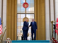 U.S. President Donald Trump shakes hands with Turkish President Recep Tayyip Erdogan during a formal arrival at the Bestepe Presidential Compound at the NATO summit in Ankara, Turkey, Tuesday, July 7, 2026.     Emrah Gurel/Pool via REUTERS