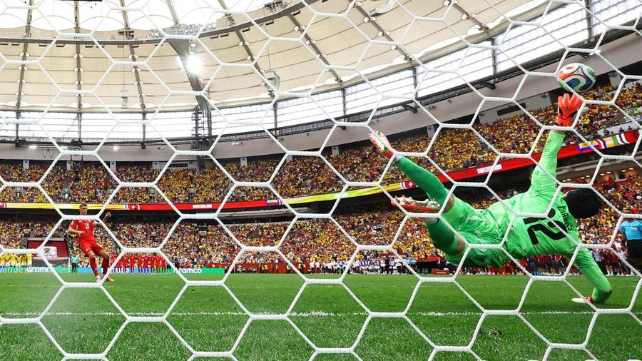 Soccer Football - FIFA World Cup 2026 - Round of 16 - Switzerland v Colombia - BC Place, Vancouver, Canada - July 7, 2026 Switzerland's Granit Xhaka scores a penalty past Colombia's Camilo Vargas during the penalty shootout REUTERS/Agustin Marcarian