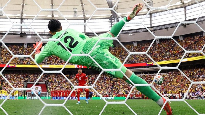 Soccer Football - FIFA World Cup 2026 - Round of 16 - Switzerland v Colombia - BC Place, Vancouver, Canada - July 7, 2026 Switzerland's Ruben Vargas scores a penalty past Colombia's Camilo Vargas to win the penalty shootout REUTERS/Agustin Marcarian