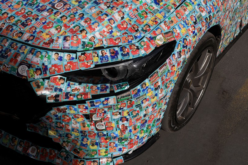 Chilean soccer fan and content creator Ariel Osses smiles while sitting in his car, which is covered with FIFA World Cup 2026 Panini stickers, fulfilling an updated version of his childhood dream of having a World Cup Panini album, in Santiago, Chile, July 6, 2026. REUTERS/Diego Reyes     TPX IMAGES OF THE DAY