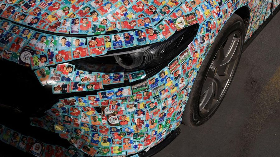 SOCCER-WORLDCUP/CHILE-STICKERS Chilean soccer fan and content creator Ariel Osses smiles while sitting in his car, which is covered with FIFA World Cup 2026 Panini stickers, fulfilling an updated version of his childhood dream of having a World Cup Panini album, in Santiago, Chile