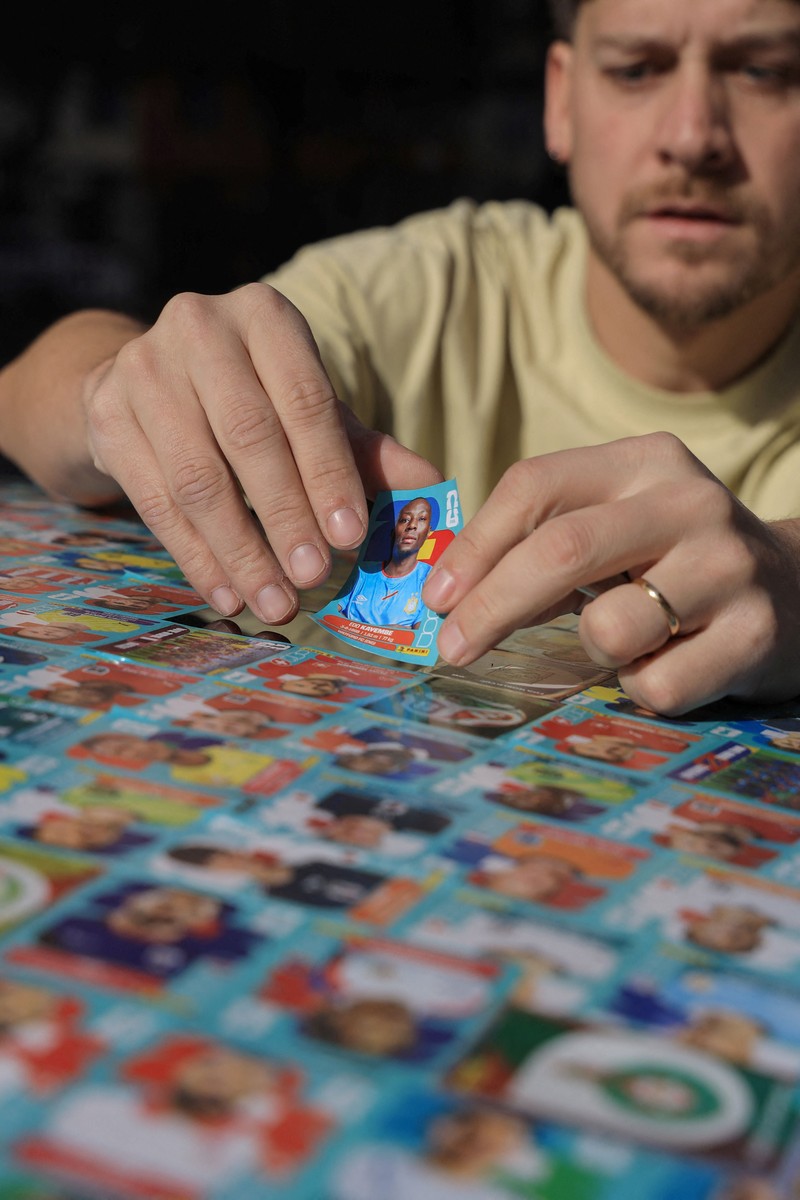 Chilean soccer fan and content creator Ariel Osses smiles while sitting in his car, which is covered with FIFA World Cup 2026 Panini stickers, fulfilling an updated version of his childhood dream of having a World Cup Panini album, in Santiago, Chile, July 6, 2026. REUTERS/Diego Reyes     TPX IMAGES OF THE DAY