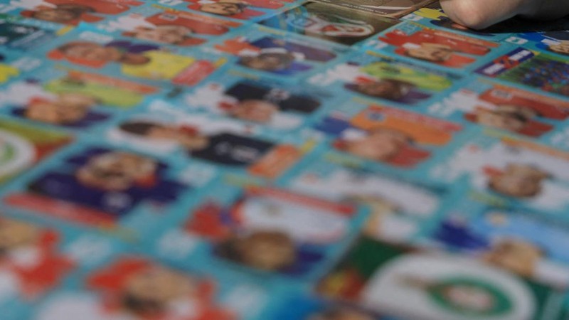 Chilean soccer fan and content creator Ariel Osses smiles while sitting in his car, which is covered with FIFA World Cup 2026 Panini stickers, fulfilling an updated version of his childhood dream of having a World Cup Panini album, in Santiago, Chile