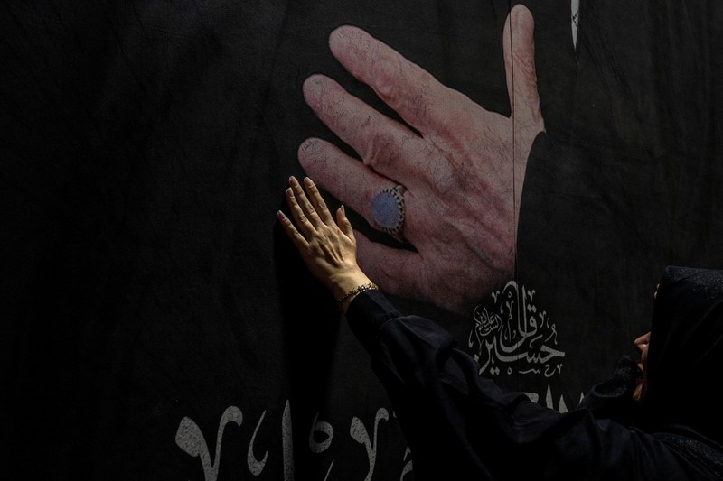 People carry the coffin of Iran's late Supreme Leader Ayatollah Ali Khamenei, who was killed on February 28 in Israeli and U.S. airstrikes, after it was unloaded from a refrigeration vehicle, during his funeral procession, in Karbala, Iraq, July 9, 2026. REUTERS/Ahmed Saad
