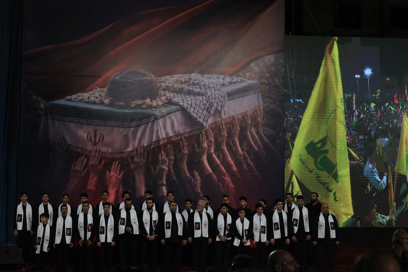 People carry the coffin of Iran's late Supreme Leader Ayatollah Ali Khamenei, who was killed on February 28 in Israeli and U.S. airstrikes, after it was unloaded from a refrigeration vehicle, during his funeral procession, in Karbala, Iraq, July 9, 2026. REUTERS/Ahmed Saad