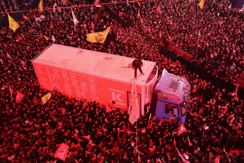 People carry the coffin of Iran's late Supreme Leader Ayatollah Ali Khamenei, who was killed on February 28 in Israeli and U.S. airstrikes, after it was unloaded from a refrigeration vehicle, during his funeral procession, in Karbala, Iraq, July 9, 2026. REUTERS/Ahmed Saad