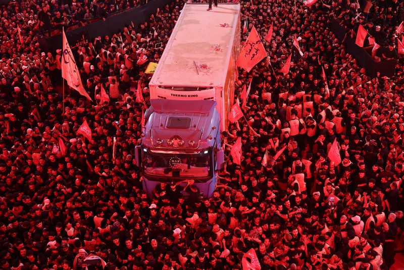 People carry the coffin of Iran's late Supreme Leader Ayatollah Ali Khamenei, who was killed on February 28 in Israeli and U.S. airstrikes, after it was unloaded from a refrigeration vehicle, during his funeral procession, in Karbala, Iraq, July 9, 2026. REUTERS/Ahmed Saad