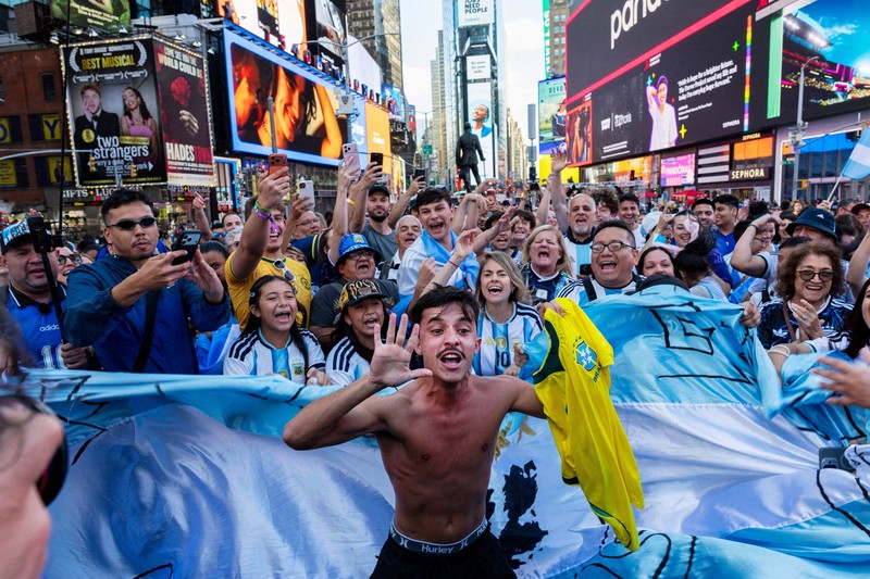 Soccer Football - FIFA World Cup 2026 - Mexico v South Africa -  Fans gather in Mexico City - Zocalo, Mexico City, Mexico - June 11, 2026 - A giant FIFA World Cup 2026 ball behind Mexico fans reacting as they watch the match REUTERS/Marian Carrasquero     TPX IMAGES OF THE DAY          SEARCH