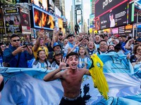 Soccer Football - FIFA World Cup 2026 - Argentina Fans gather in Times Square, New York - New York, New York, U.S. - June 15, 2026 A man holds a Brazil shirt as Argentina fans gather in Times Square REUTERS/Carolina Herrera     TPX IMAGES OF THE DAY